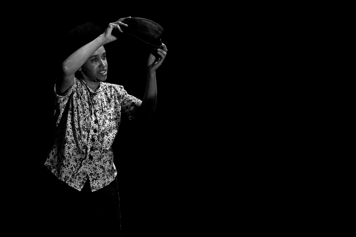 Black & White photo of Veneshia dancing with a hat
